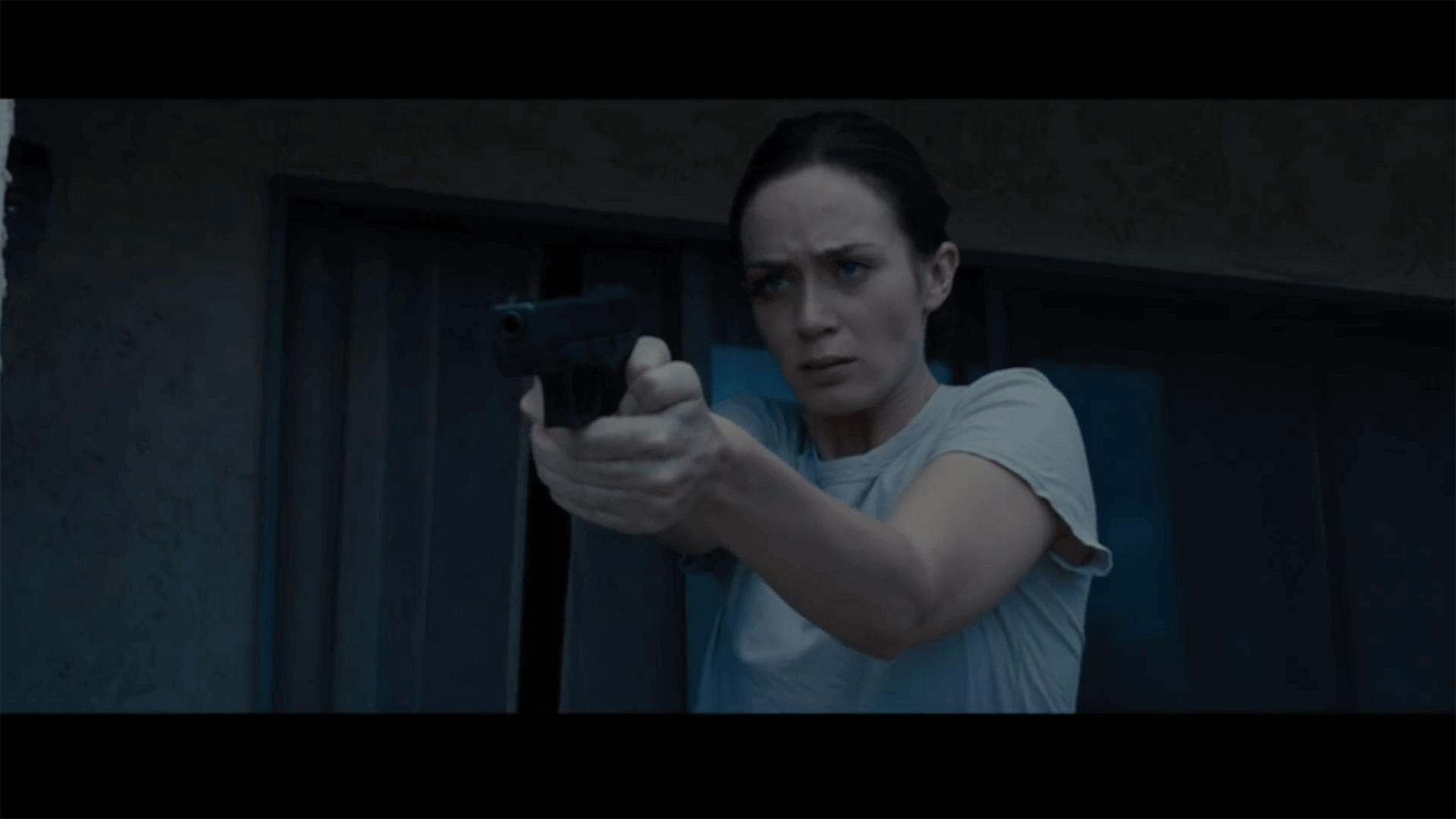 Emily Blunt holding a gun